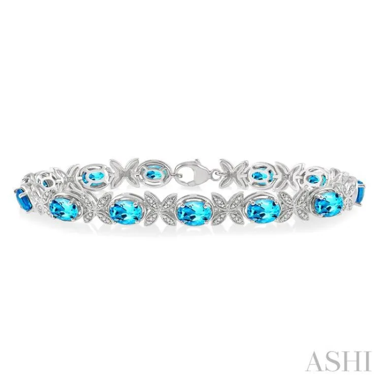 1/10 ctw Round Cut Diamond & 7x5MM Oval Cut Blue Topaz Semi Precious Bracelet in Silver