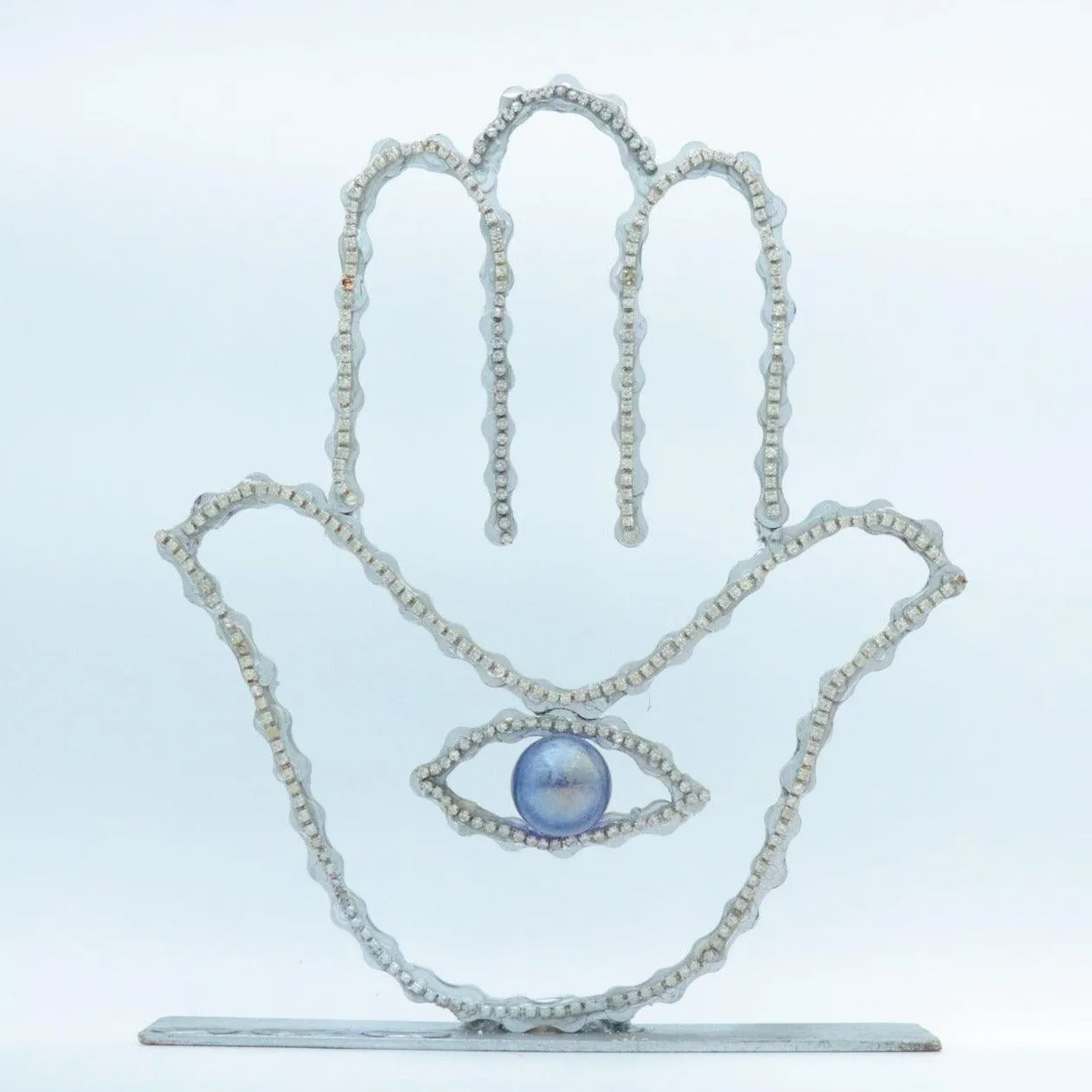 On A Stand Shimmering Hamsa Sculpture