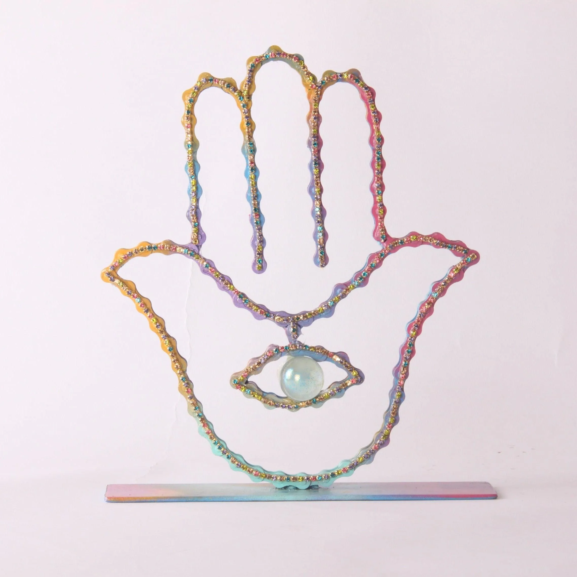 On A Stand Shimmering Hamsa Sculpture