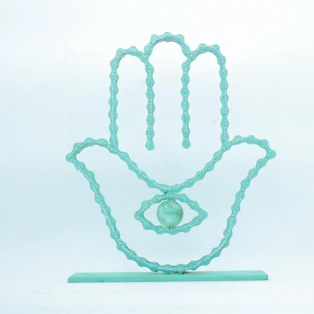 On A Stand Shimmering Hamsa Sculpture